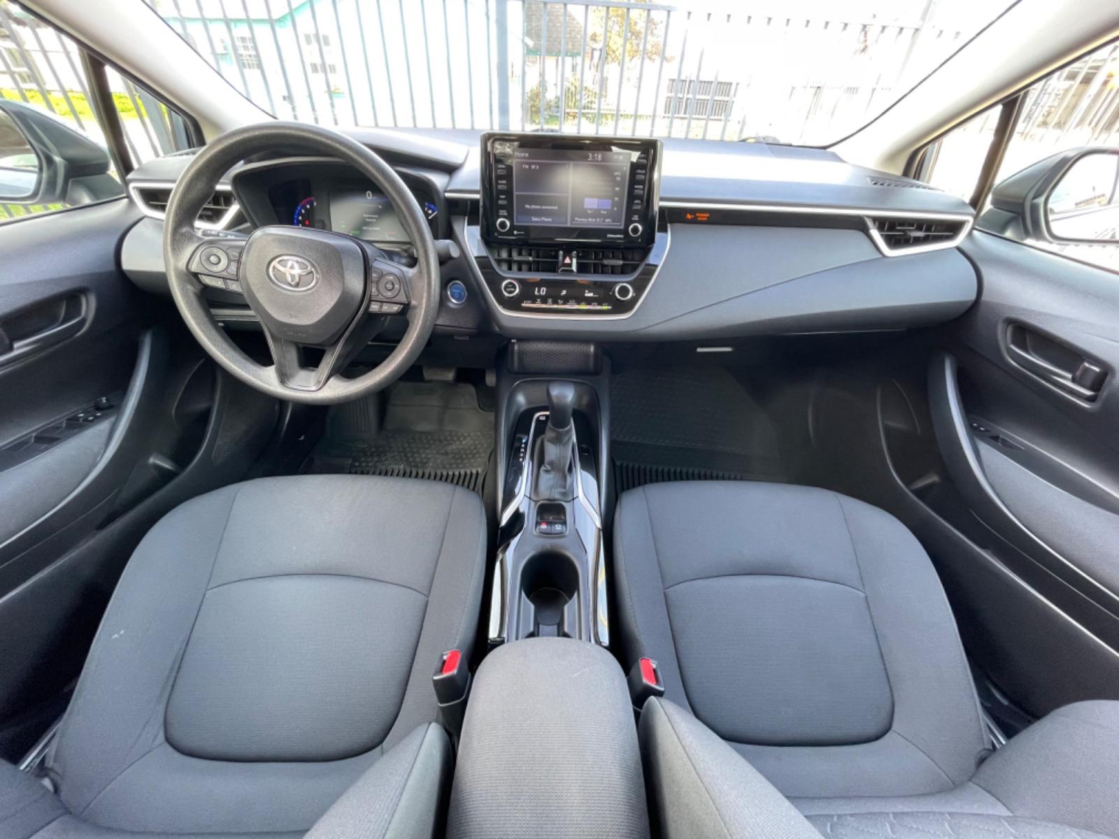 2022 Blue /Silver Toyota Corolla LE (JTDEAMDEXNJ) with an 1.8L Hybrid engine, Automatic transmission, located at 1501 West 15th St., Houston, 77008, (713) 869-2925, 29.797941, -95.411789 - Photo #8